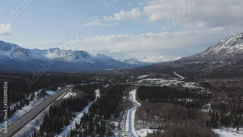 Alaska Pipeline with the pump station in the back ground and Richardson Highway of to the side. photo