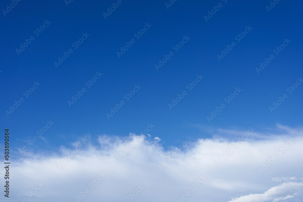 Blue sky with white cloud. Beautiful sky background with copy space. Clear day and good weather