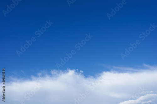 Blue sky with white cloud. Beautiful sky background with copy space. Clear day and good weather