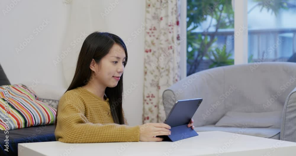 Woman read on tablet computer at home Woman read on tablet computer at home