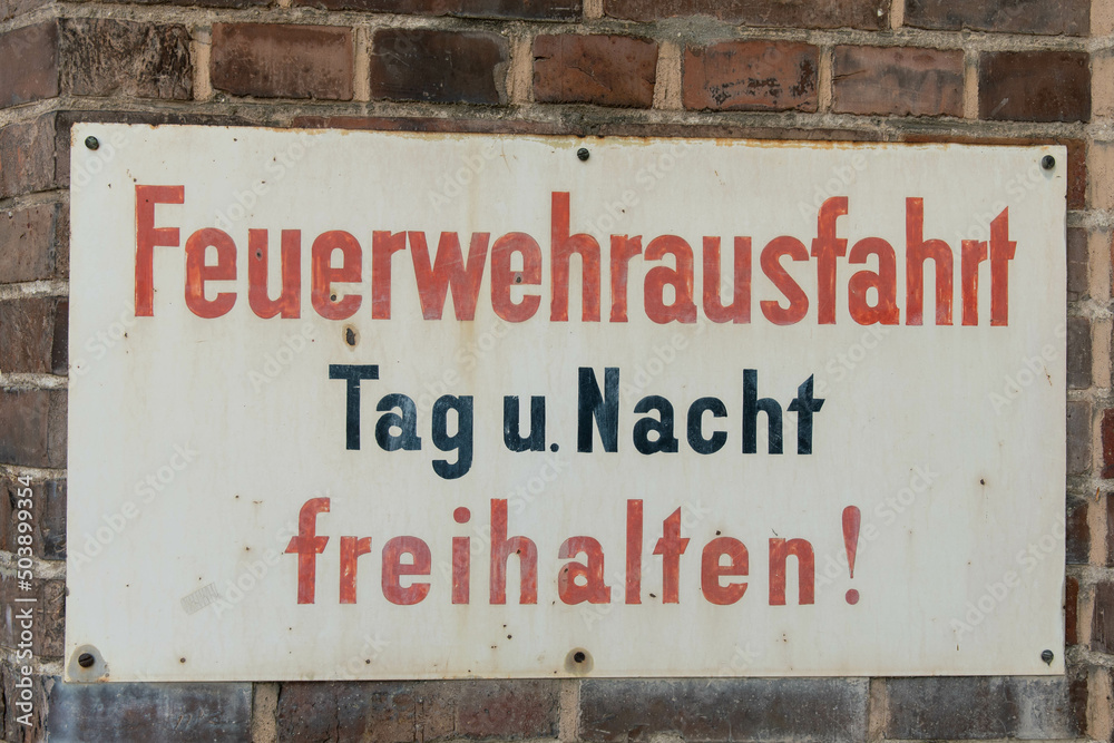 Old sign with the German inscription Keep fire station clear day and night