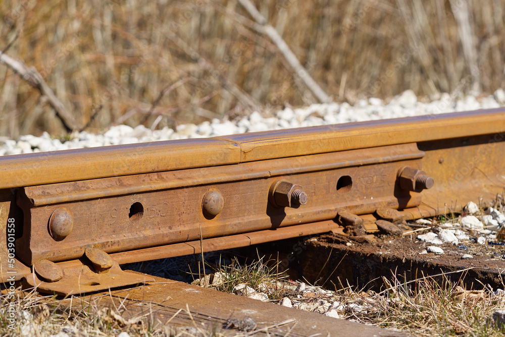 Broken Connecting two rails. with visible bolts. Train tracks underlay ...