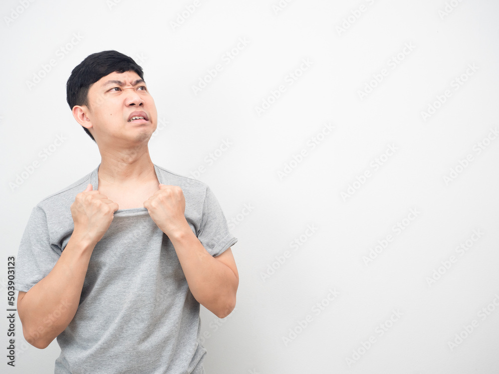 Man feeling heat stroke with hot weather gesture looking at copy space Man feeling heat stroke with hot weather gesture looking at copy space