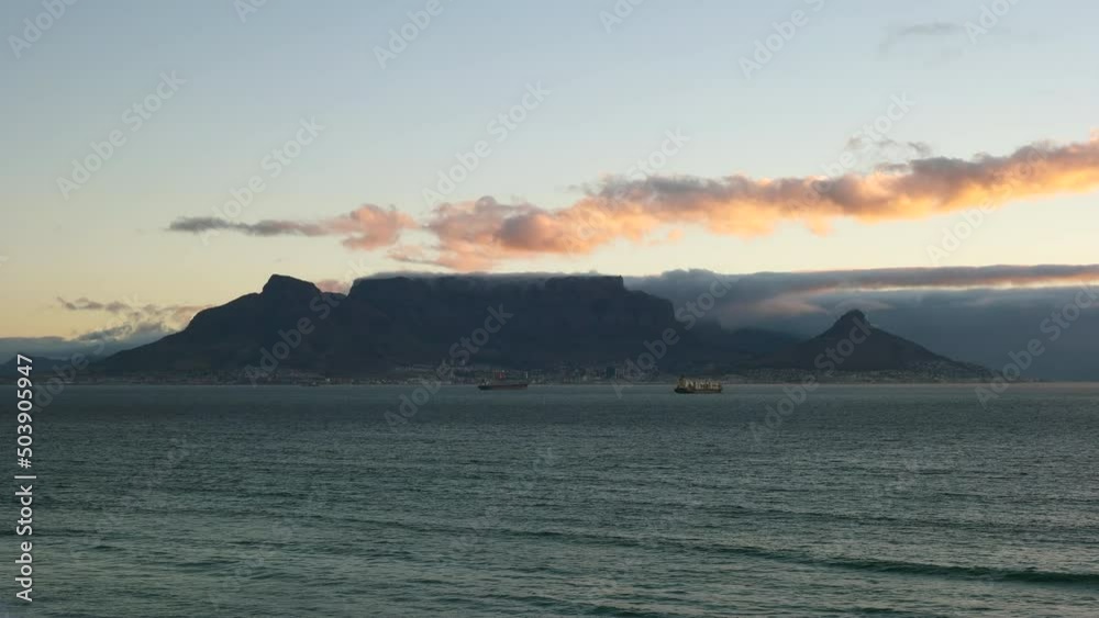 Dramatic View Of Table Mountain National Park During Sunset In Cape Town, South Africa. Tilt-down Shot Dramatic View Of Table Mountain National Park During Sunset In Cape Town, South Africa. Tilt-down Shot