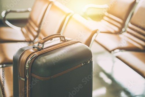 travel luggage bag in airport at waiting area for holiday vacation traveller visitor flight concept