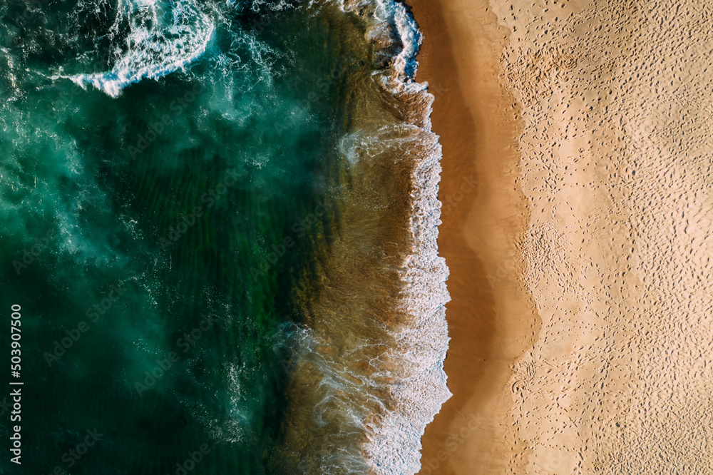 Top down aerial of deserted beach in Portugal captured from a drone