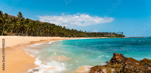 Tropical beautiful landscape, turquoise ocean and bright sand beach, paradise vacation on island.