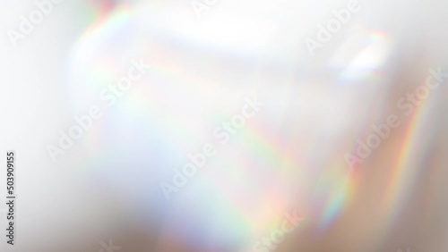 Slow Play Rainbow Crystal. Loop. The light passes through the facets of a slowly rotating diamond and creates repetitive sparkling highlights and rainbow colors