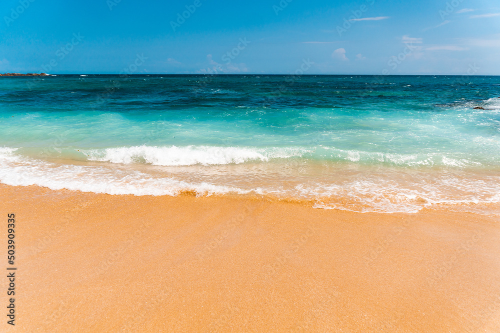 Fototapeta premium Tropical beautiful landscape, turquoise ocean and bright sand beach, paradise vacation on island.