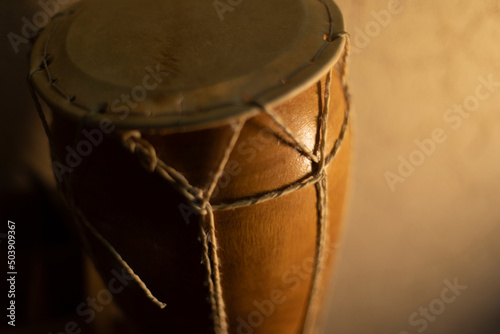 Wooden drum. African percussion instrument. Traditional musical instrument.