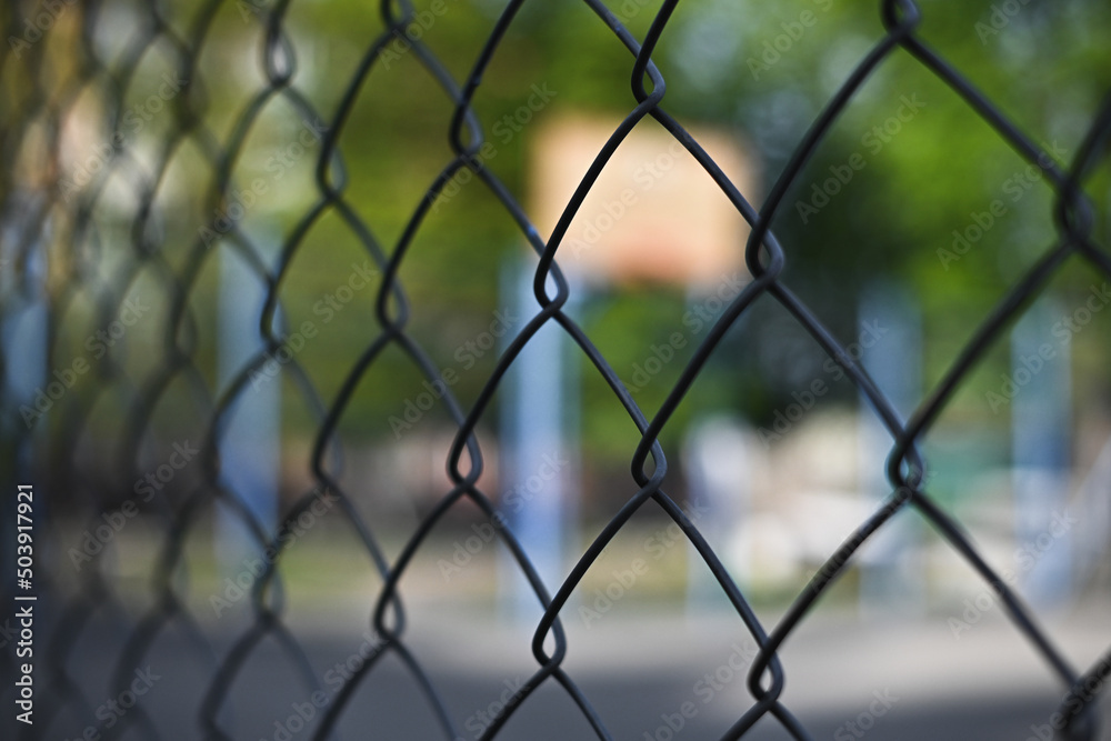 chain link fence against a basketball court chain link fence against a basketball court