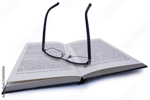 Pair of Glasses on Book photo