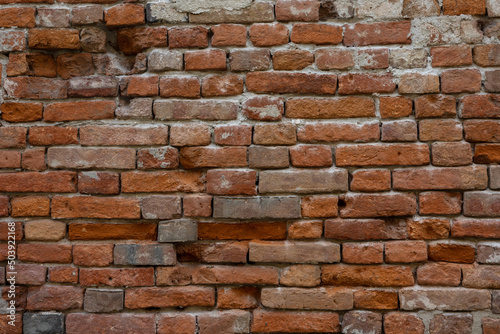 wall with ancient red bricks. background