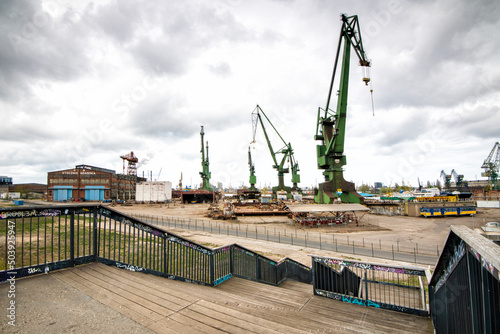 green giant cranes on the skylnie at the shipyard in gdansk poland