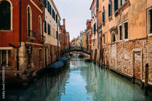 Traditional narrow canal street with old houses in Venice, Italy. Italy beauty, one of canal streets in Venice, Venezia © Strikernia