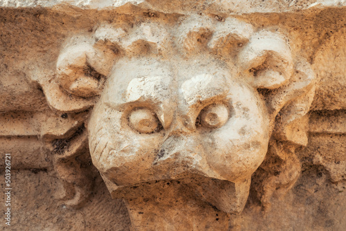 Ancient lion head relief sculpture in the Side Ancient City, Turkey. Ruins of the ancient city. Eastern Roman | Byzantine stone carving.