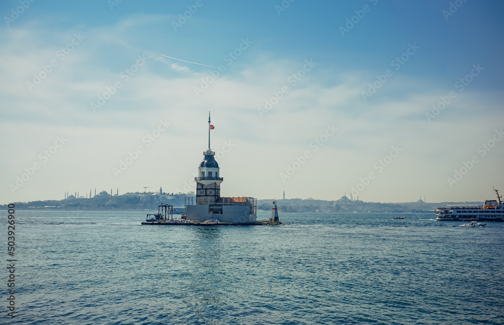 beautiful view on Maiden's Tower (Kiz Kulesi) in Istanbul with the city of Istanbul in backgrounds.