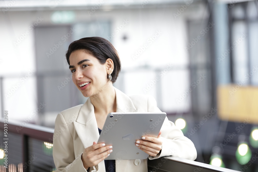 Smiling businesswoman using tablet Smiling businesswoman using tablet