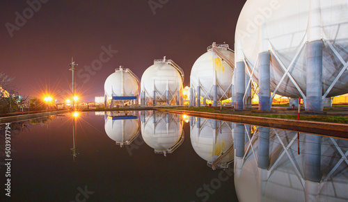 Natural gas tank at night - LNG or liquefied natural Industrial Spherical gas storage tank photo
