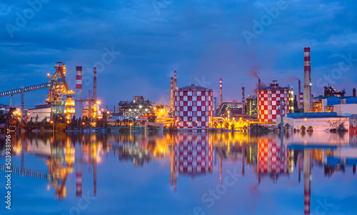 Metallurgical plant with black smoke and Steel factory with smokestacks - Metallurgical works, industrial production process.