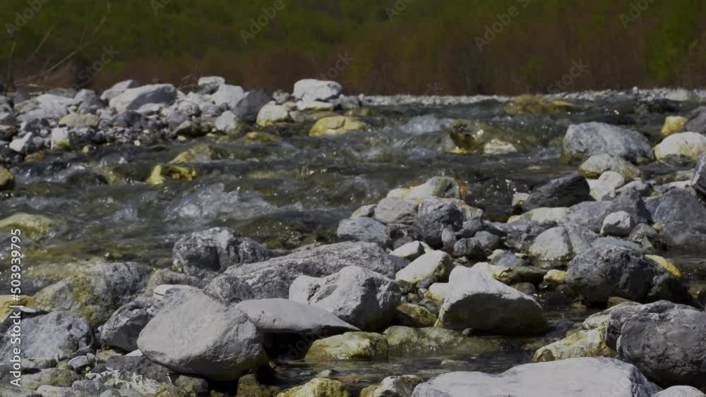 Clear water of mountain river streaming through cliffs, quiet landscape Clear water of mountain river streaming through cliffs, quiet landscape