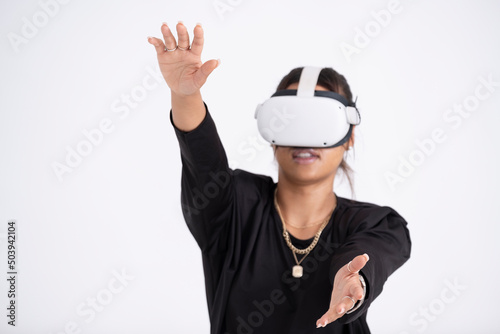 Studio shot of young woman wearing VR headset