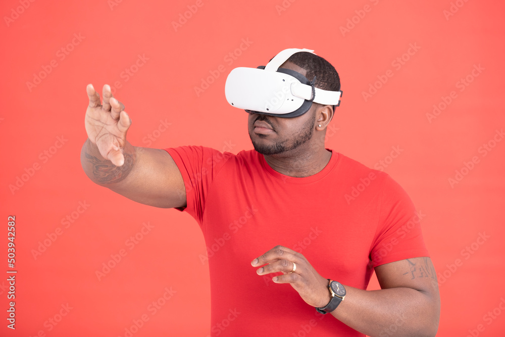 Studio shot of man wearing VR goggles Studio shot of man wearing VR goggles