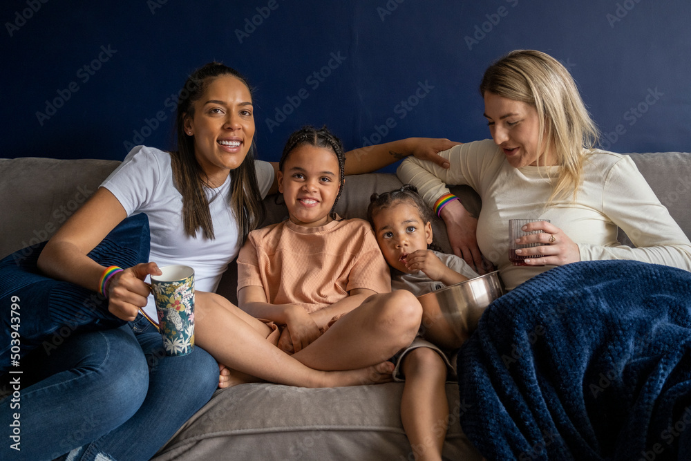 Mothers and sons watching TV Stock Photo | Adobe Stock