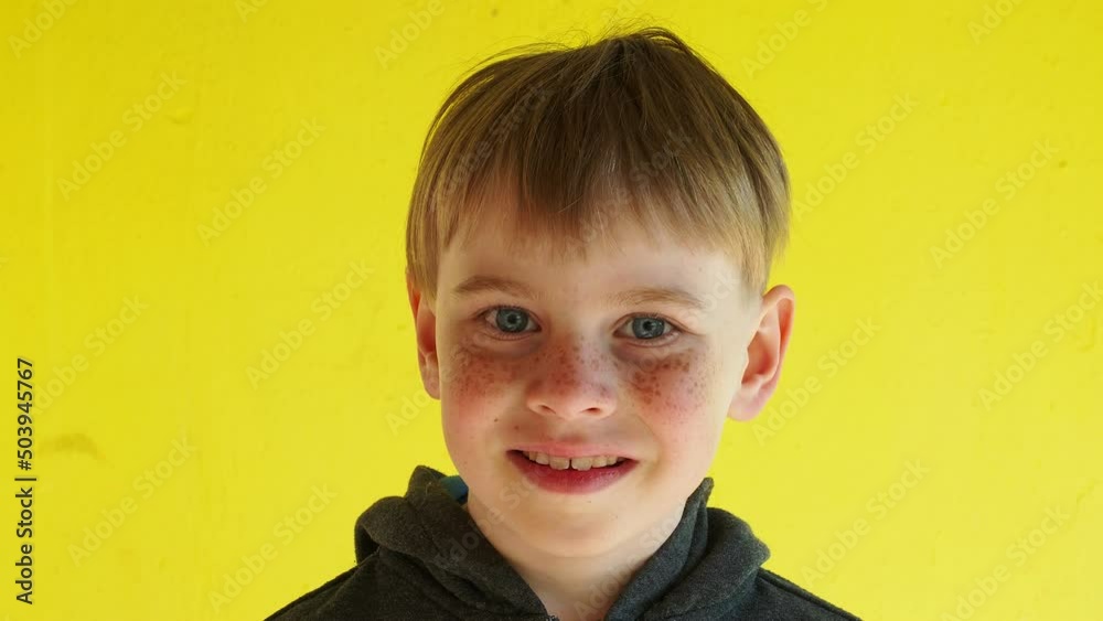 close-up portrait of a blond boy close-up portrait of a blond boy