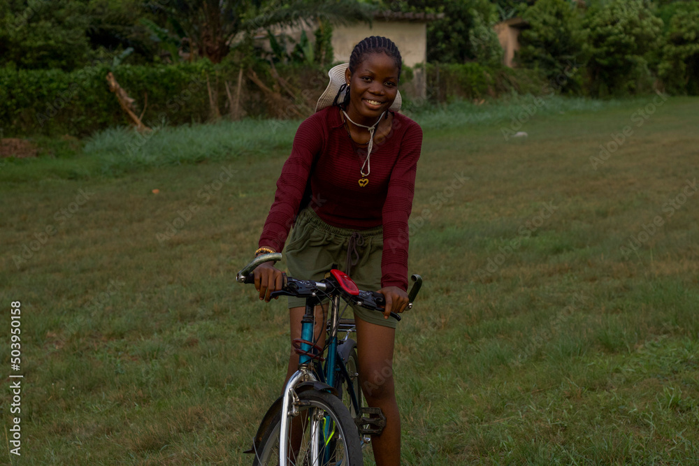 Portrait of young woman on bicycle