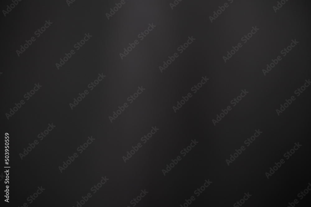 Dark black and gray blurred background has a little abstract light. soft background for wallpaper,design,graphic and presentation