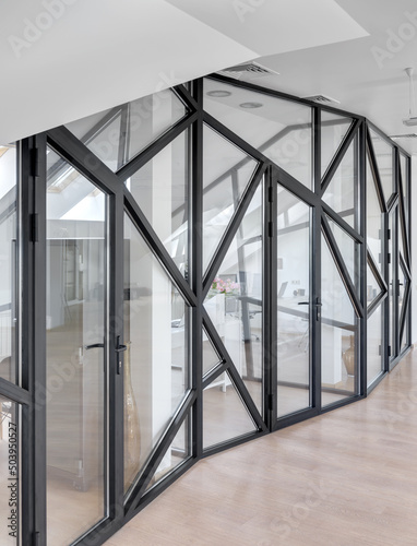 glass partition in a white office  window with black frame