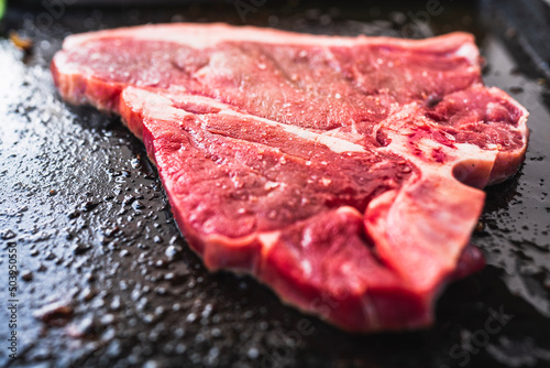 raw beef T bone steak 