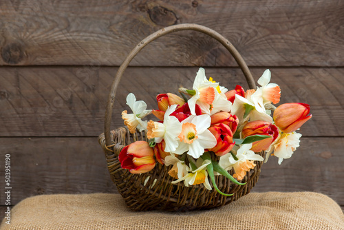 bouquet of spring flowers in a basket photo