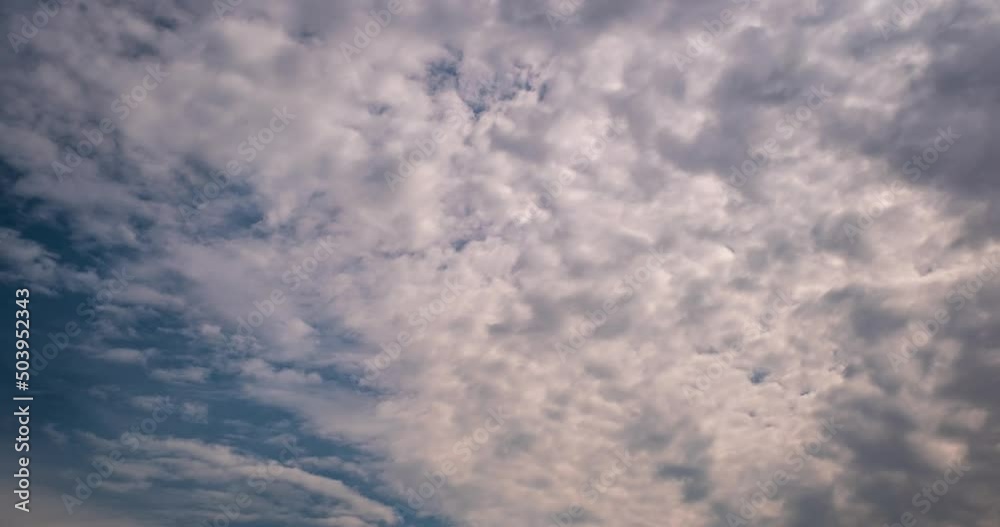 Timelapse of sky background with tiny striped clouds before storm with dark clouds Timelapse of sky background with tiny striped clouds before storm with dark clouds