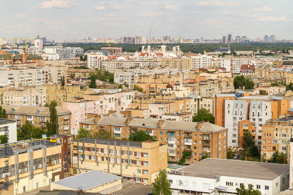 Kyiv, Ukraine – July 08, 2017: A beautiful panorama of Podil area. Aerial view on residential and industrial areas. A lot of buildings of different architectural style. Historical area, Dnipro river. Kyiv, Ukraine – July 08, 2017: A beautiful panorama of Podil area. Aerial view on residential and industrial areas. A lot of buildings of different architectural style. Historical area, Dnipro river.