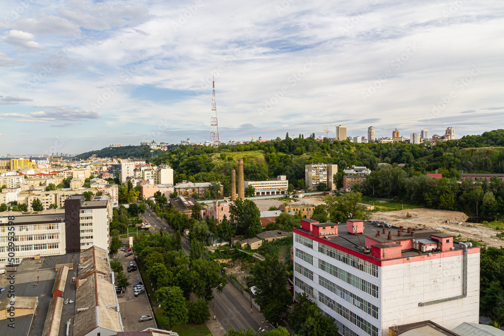 Kyiv, Ukraine – July 08, 2017: A beautiful panorama of Podil area. Aerial view on residential and industrial areas. A lot of buildings of different architectural style. Historical area, Dnipro river.