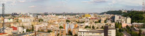 Kyiv, Ukraine – July 08, 2017: A beautiful panorama of Podil area. Aerial view on residential and industrial areas. A lot of buildings of different architectural style. Historical area, Dnipro river.