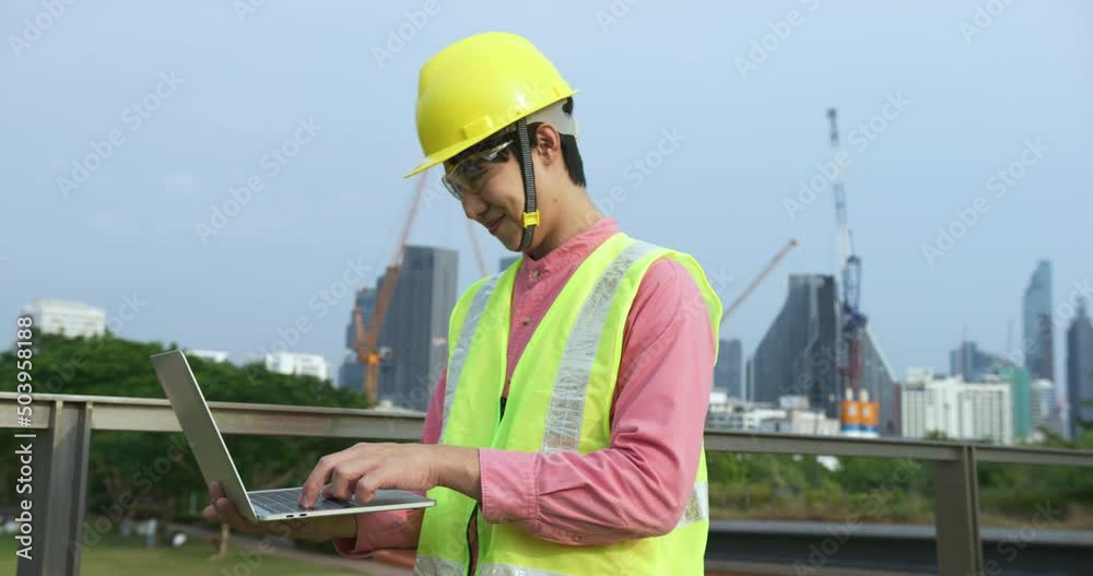 Young confident asian engineer using digital tablet working at construction site Young confident asian engineer using digital tablet working at construction site