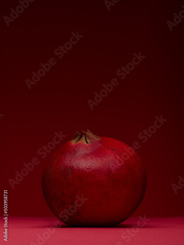 pomegranate on a red background