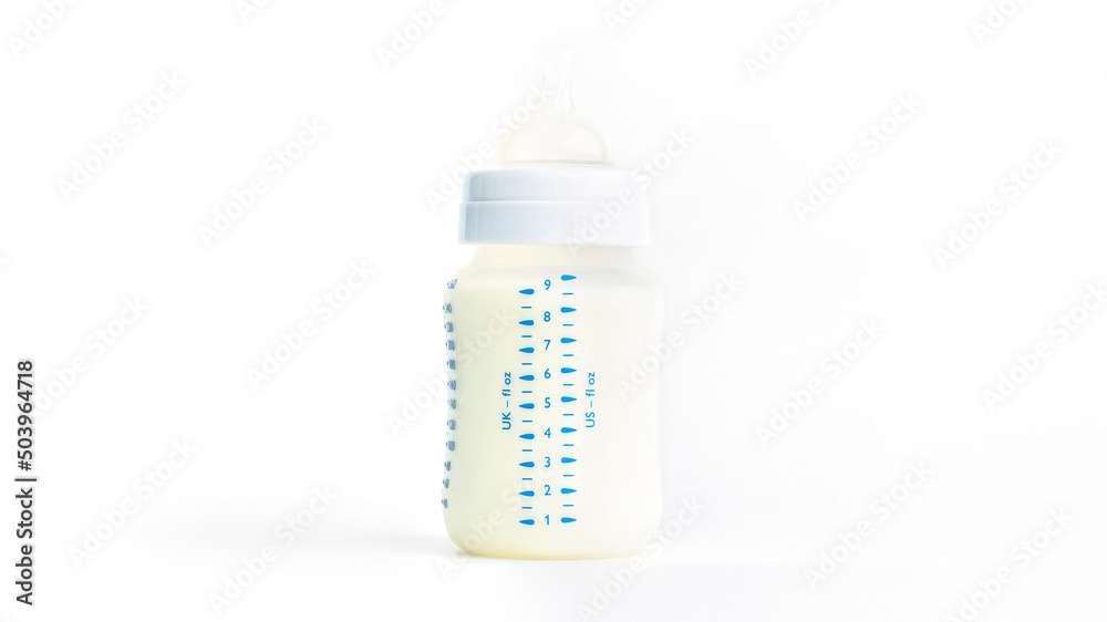 Baby bottle with milk on a white background Baby bottle with milk on a white background