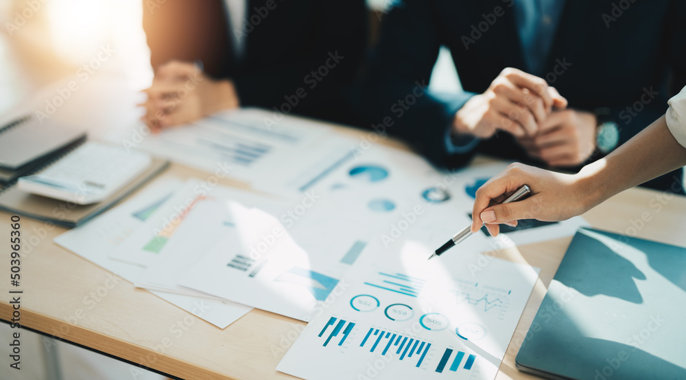 Asian business adviser meeting to analyze and discuss the situation on the financial report in the meeting room.Investment Consultant, Financial advisor and accounting concept. Asian business adviser meeting to analyze and discuss the situation on the financial report in the meeting room.Investment Consultant, Financial advisor and accounting concept.