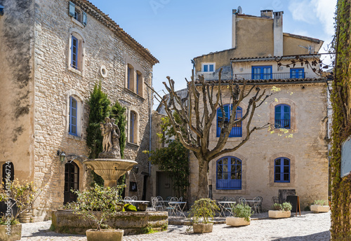 Saignon, France - April 2022: The beautiful fountain of Saignon in the center of the charming village in the south of France