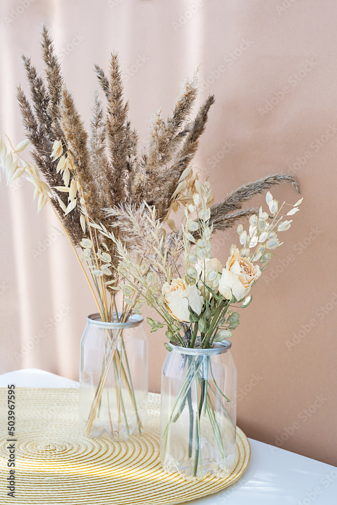 Dried flowers bouquets in plastic bottles to reduce waste. Aesthetic, eco friendly home decor. Dried flowers bouquets in plastic bottles to reduce waste. Aesthetic, eco friendly home decor.
