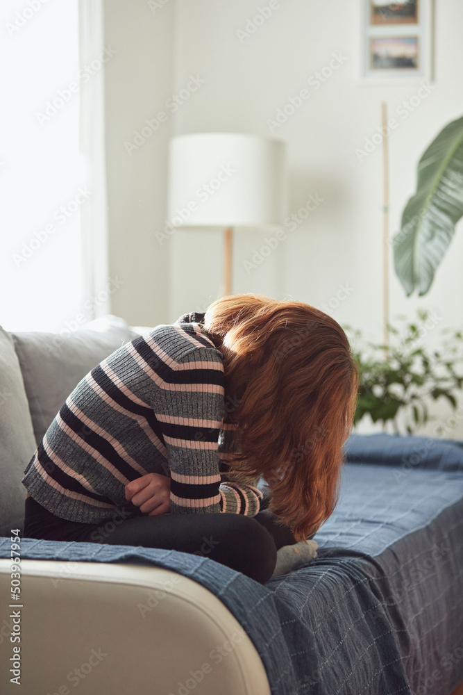 Obraz premium Teenage girl being bored and difficult at home.
