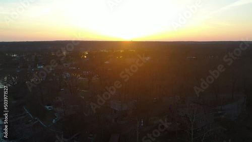 Beautiful Sunset Over Lake Houses at Highland Reservoir Grand Lake O' the Cherokees In Midwest Oklahoma Looking Over Reservoir and Forest - aerial drone shot photo