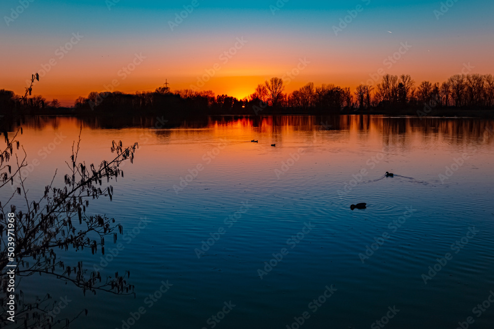 Beautiful sunset with reflections near Plattling, Isar, Bavaria, Germany