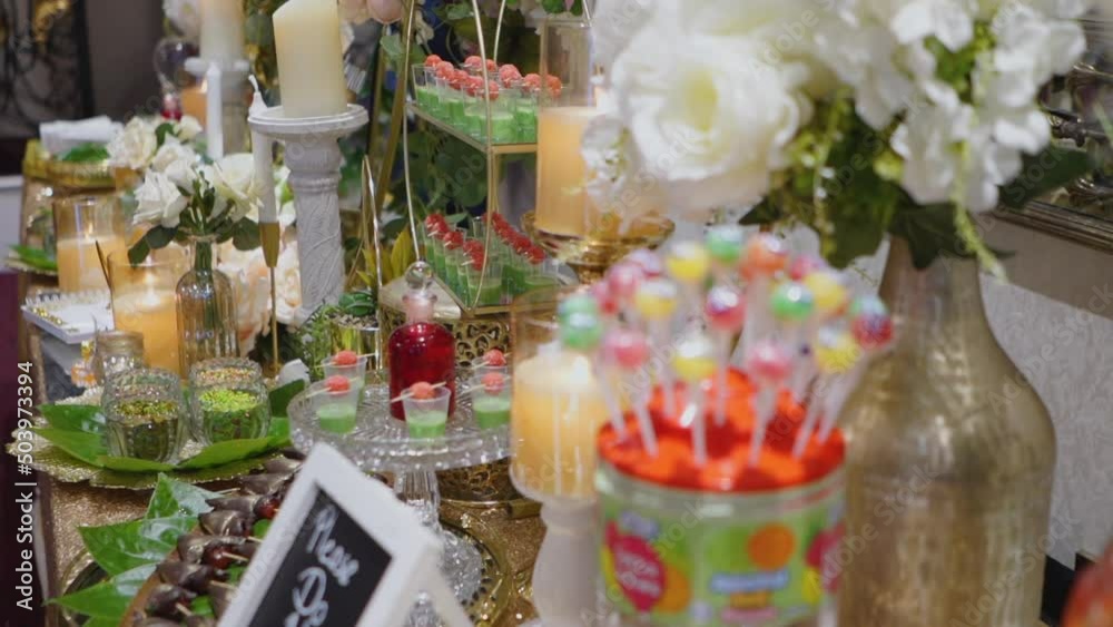 A sugary candy stall adorn with lollipops and many more deserts on a vanue. Leaves of the betel plant wrapped around tobacco, fruit, etc. and chewed. A sugary candy stall adorn with lollipops and many more deserts on a vanue. Leaves of the betel plant wrapped around tobacco, fruit, etc. and chewed.