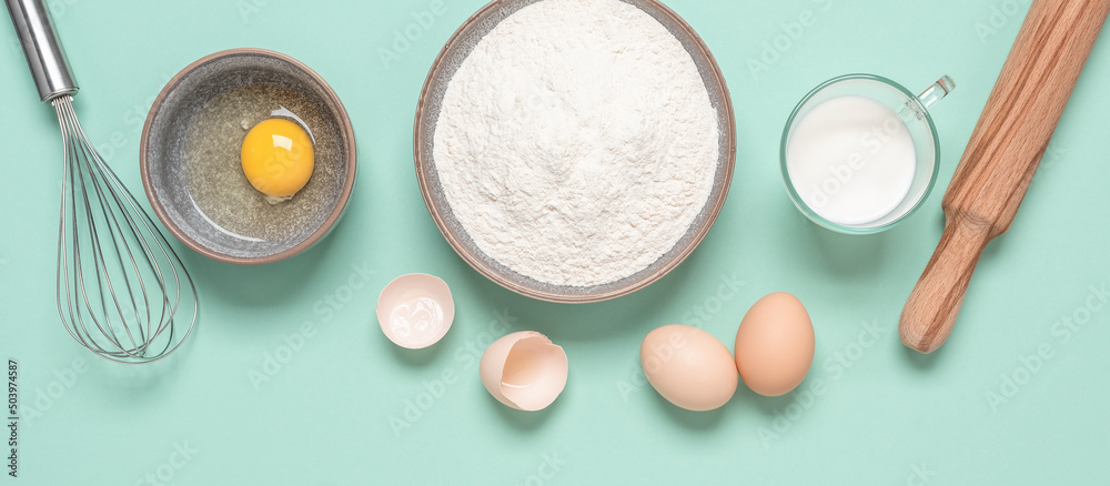 Baking ingredients on mint green pastel background. Baking background. Top view, flat lay. Banner Baking ingredients on mint green pastel background. Baking background. Top view, flat lay. Banner