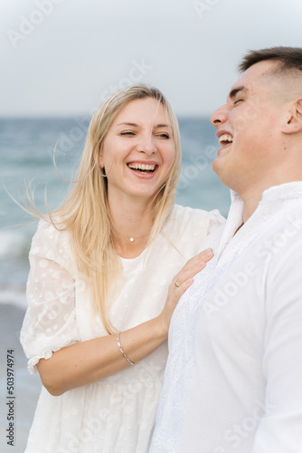 Couple in love, enjoying the summer time by the sea. © Bohdan